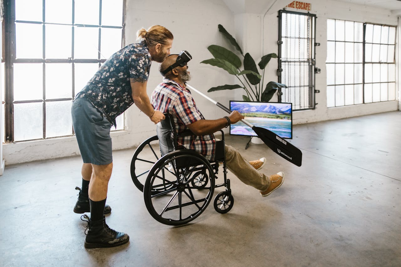 Men using virtual reality for rehabilitation indoors, fostering inclusivity and innovative therapy.